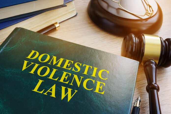 Domestic violence law on a wooden table