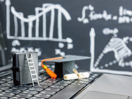 black graduation cap on computer keyboard