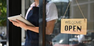 woman standing at coffee shop entrance