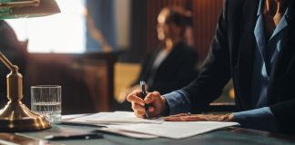 Court of Justice and Law Trial: Female Public Defender Writes Down Arguments for Defence Strategy. Successful Attorney Lawyer Fight for Freedom of Her Client with Supporting Evidence. Close Up.