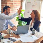 Two business workers happy and confident