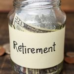 Retirement label on a jar filled with money