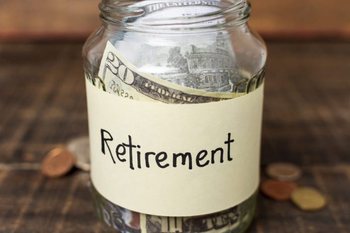 Retirement label on a jar filled with money