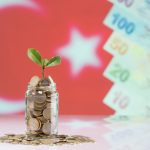 Turkish coin in Jar with the turkey flag in the background