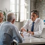 Adult couple having a meeting with their accountant