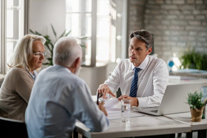 Adult couple having a meeting with their accountant