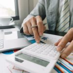 Businessman using calculator for finance accounting