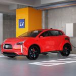 electric red SUV recharging