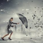 Woman with umbrella against disaster