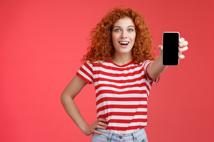 Woman showing her phone