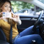 Female holding a driver license