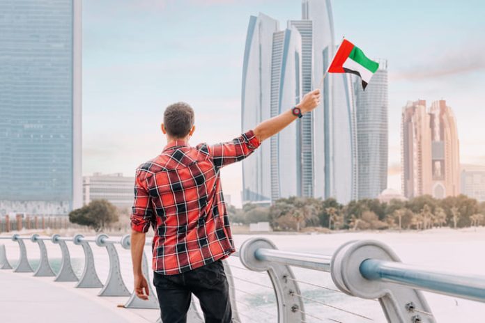 Resident in Dubai holding a flag