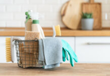 Modern kitchen interior in the background. House cleaning concept.