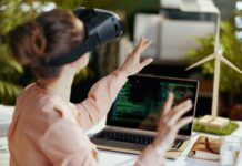 Female with laptop and vr gear in modern office