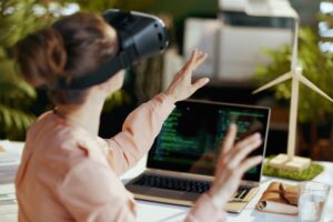 Female with laptop and vr gear in modern office