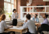 Female employee sharing stories to her colleague