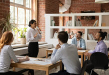 Female employee sharing stories to her colleague