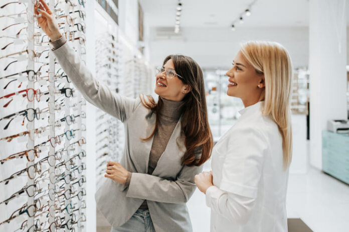 Woman choosing eye glasses