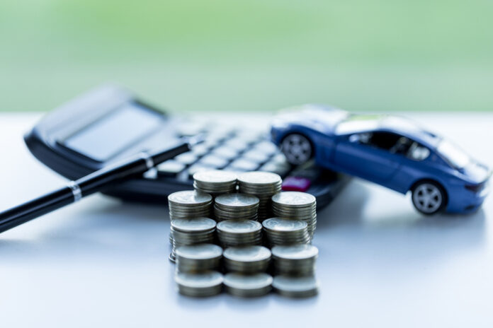 coins stack, car and calculator