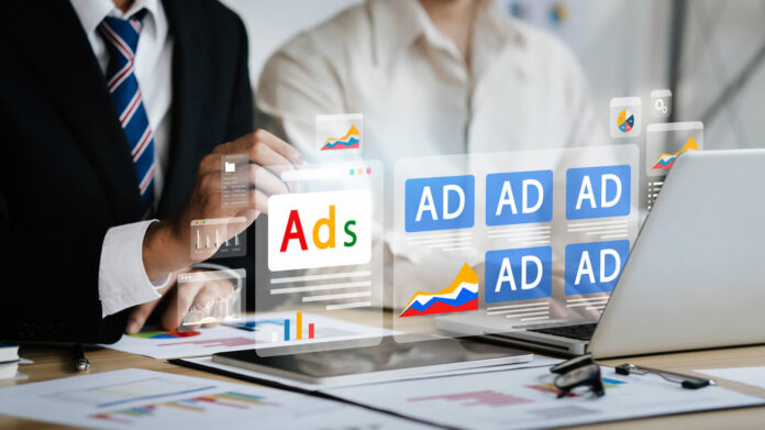 Digital marketing concept, online advertising, website ads and social media. Businessman uses laptop to analyze digital marketing strategy for branding and Ads SEO PPC goals