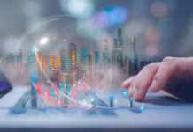 Businessman using computer working at virtual trading graph