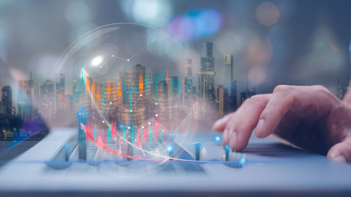 Businessman using computer working at virtual trading graph