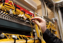 Technician attaching fiber optic