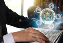 Businessman use Laptop with virtual screen bitcoin and fintech