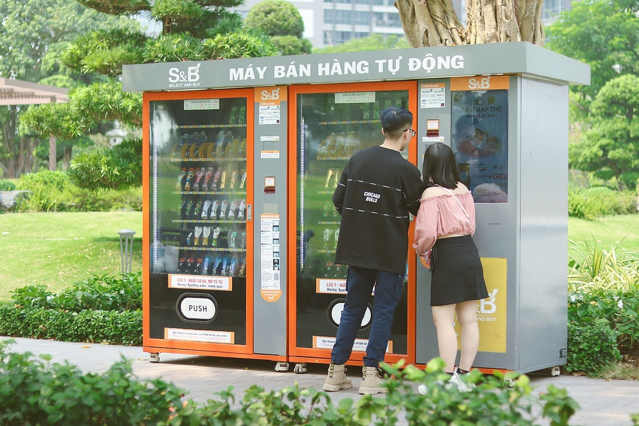 Couple buying at Vending machine