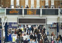 People walking through a train station