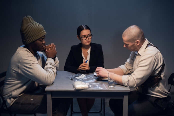 A drug dealer detained with a package containing an unknown white substance is interrogated by an experienced investigator in the presence of a lawyer.