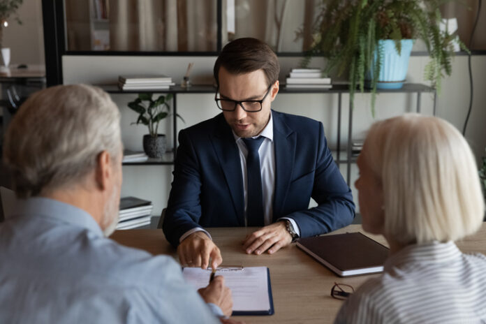 Confident lawyer with mature clients