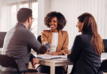 Business people shaking hands after meeting