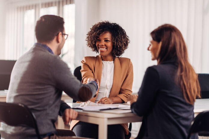 Business people shaking hands after meeting