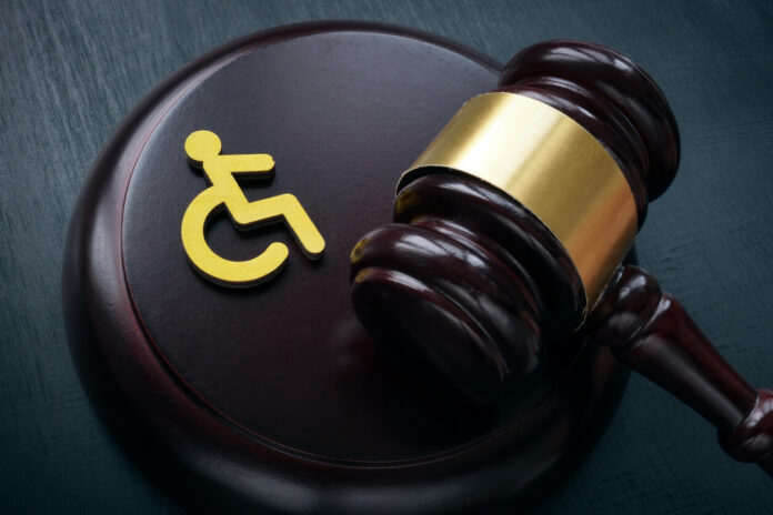 Disabled person sign and gavel.