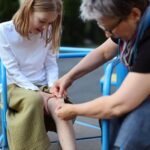 Young girl in pain after a playground injury