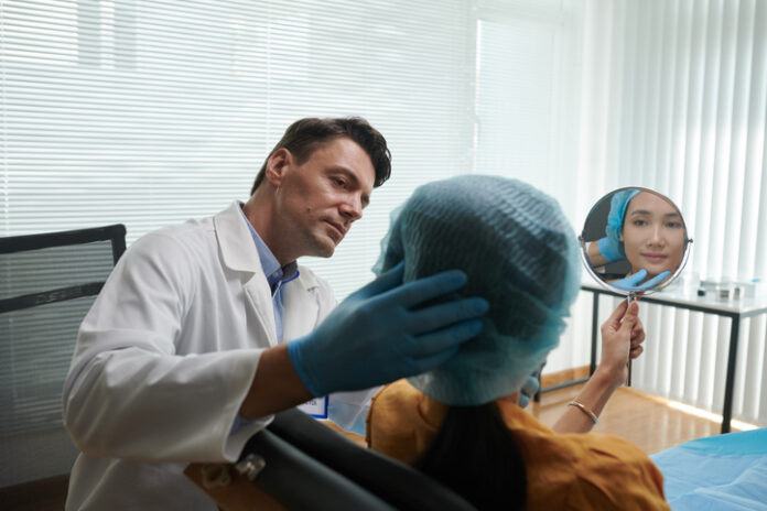 Plastic Surgeon Talking to Patient