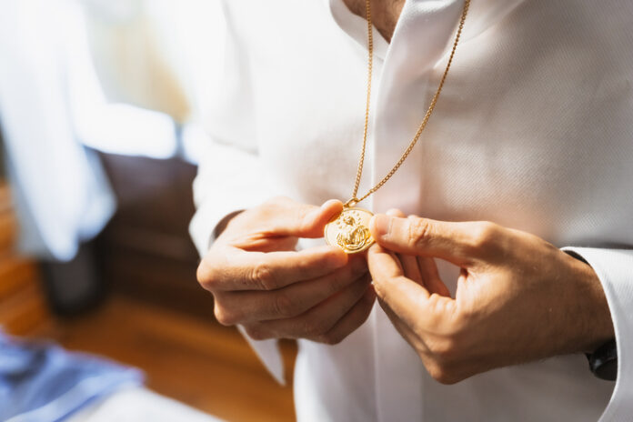 Man wearing a gold necklace