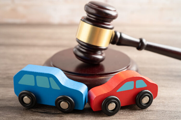 Hammer gavel judge with car vehicle accident, insurance coverage claim lawsuit court case