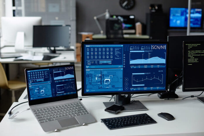 laptop and monitor on desk