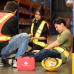 Male worker has an accident on the floor in warehouse site