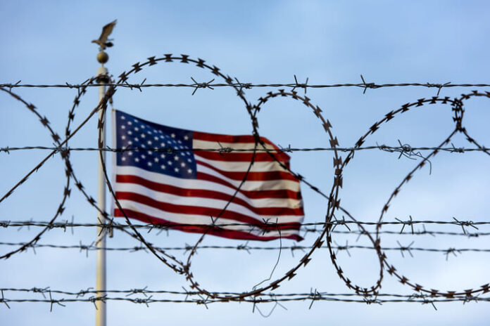 American flag and barbed wire, USA border