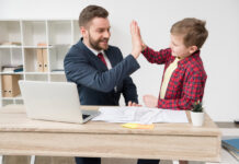 White collar worker with son at office