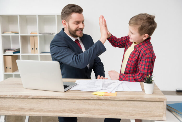 White collar worker with son at office