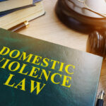 Domestic violence law on a wooden table