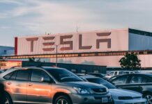 Cars Parked In Front Of Company Building