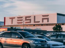 Cars Parked In Front Of Company Building