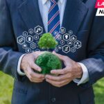 Businessman holding a globe with icon carbon credit reducing to a sustainable climate solution