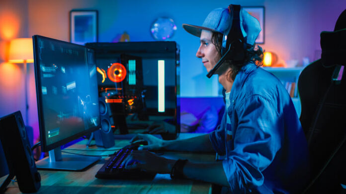 Professional Gamer Playing First-Person Shooter Online Video Game on His Powerful Personal Computer