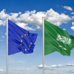 Thick colored silky flags of European Union and Saudi Arabia